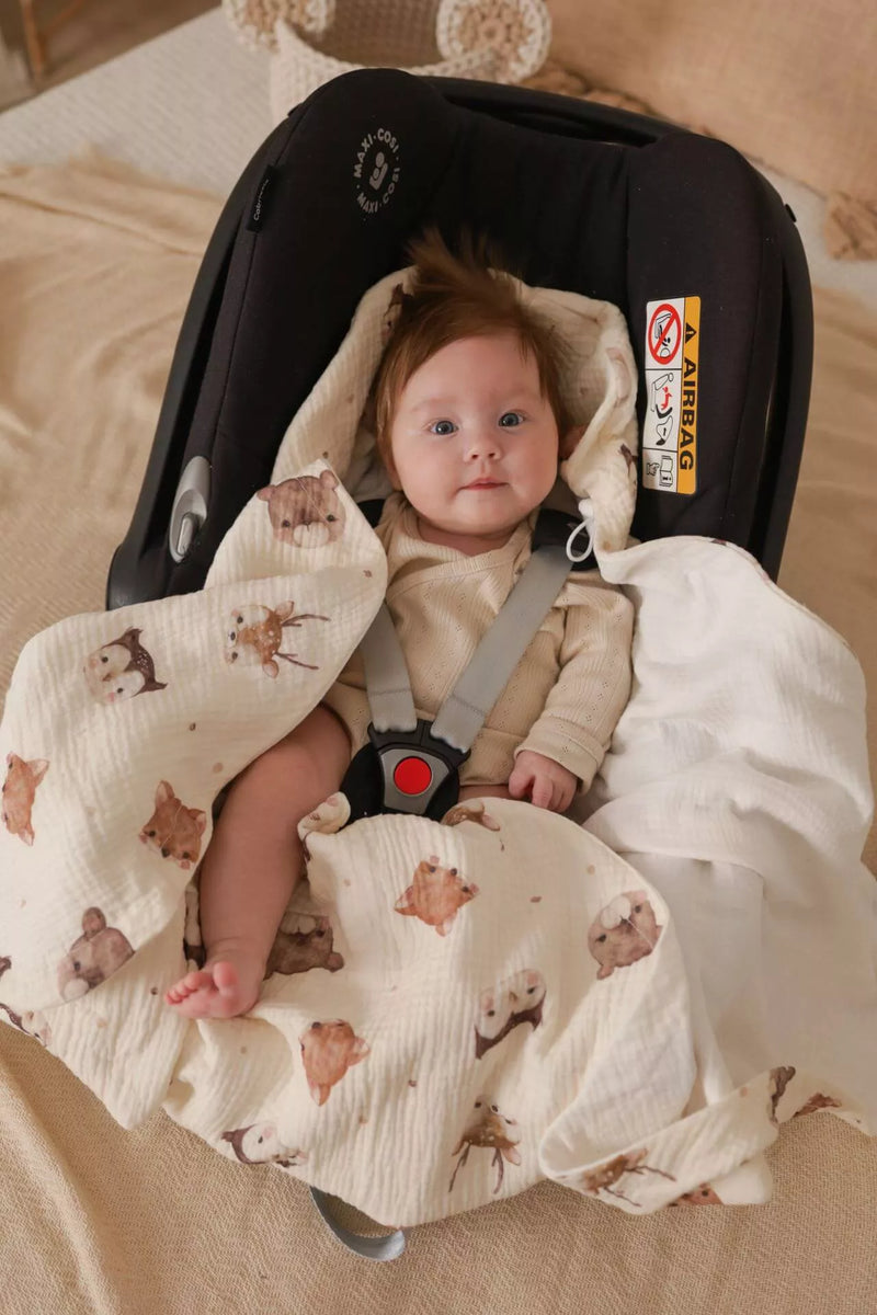 Baby in a summer car seat blanket